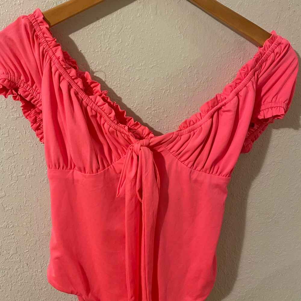 Pink body suit